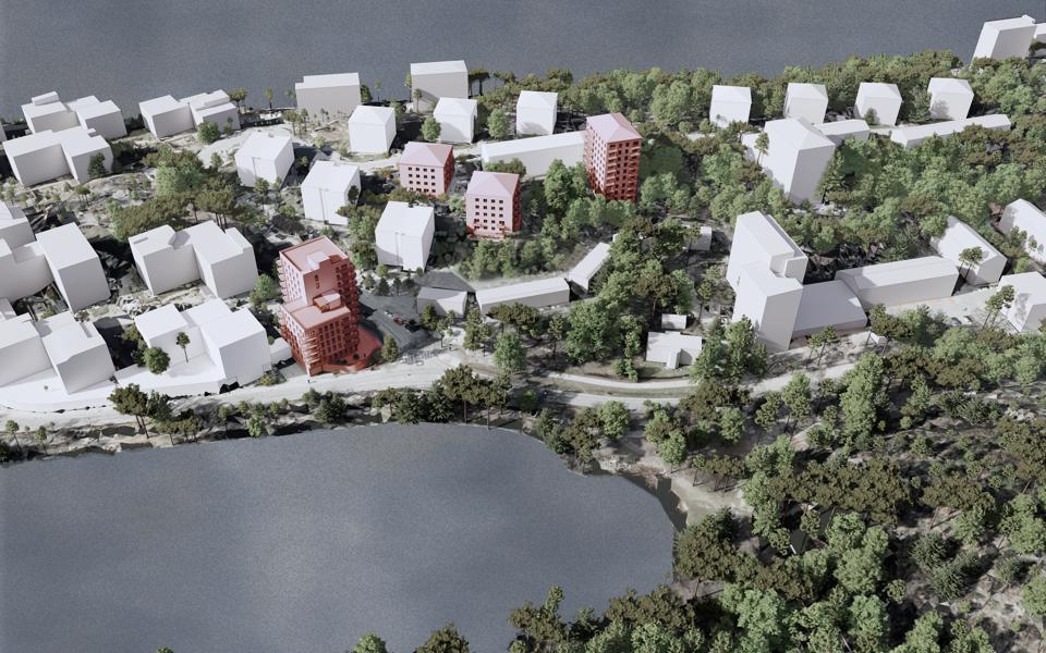 3D illustration. Flygvy över Ekensberg från söder med Gröndalsvägen i förgrunden. Befintliga byggnader är illustrerade med vita kuber och föreslagen bebyggelse är markerad med röd färg.